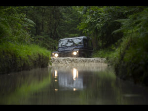 Land Rover Defender Driving Through Water