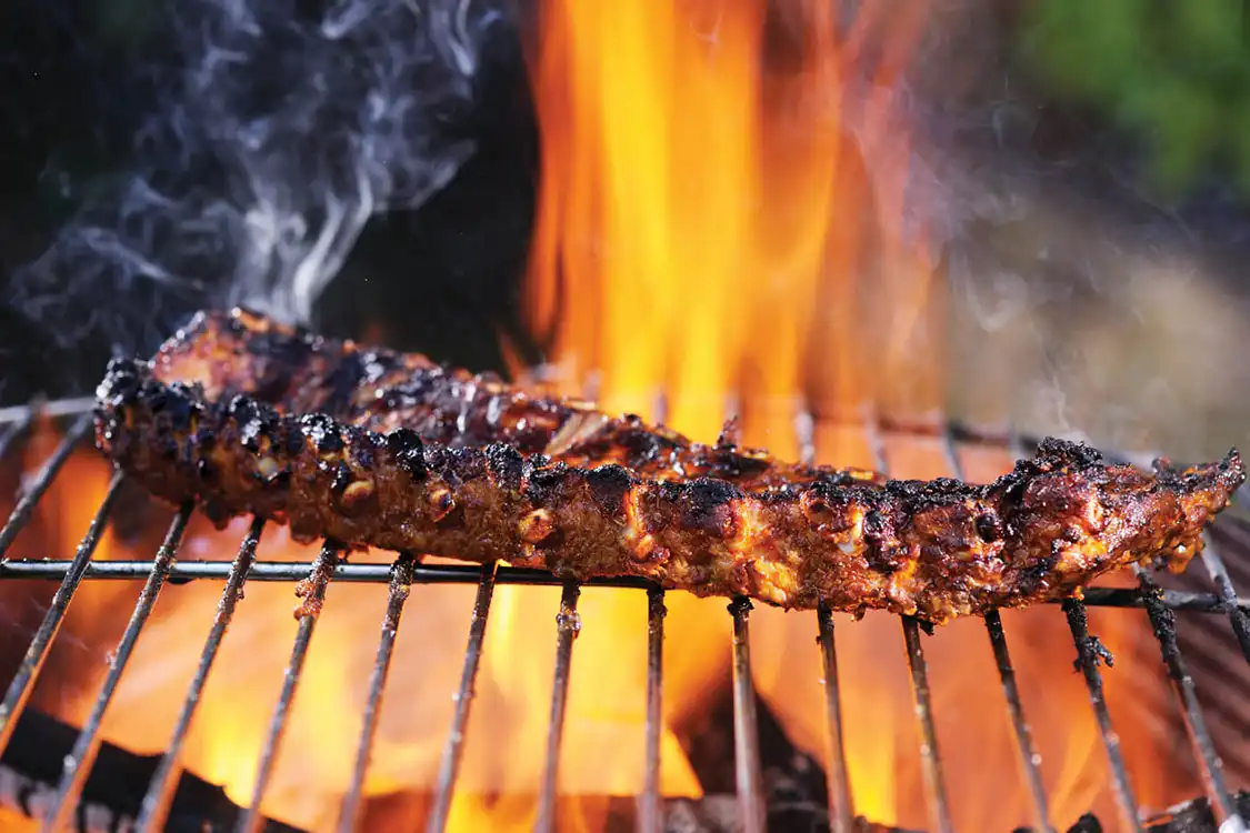 Creating a two- zone grilling area is crucial to keeping your meat at a good temperature.