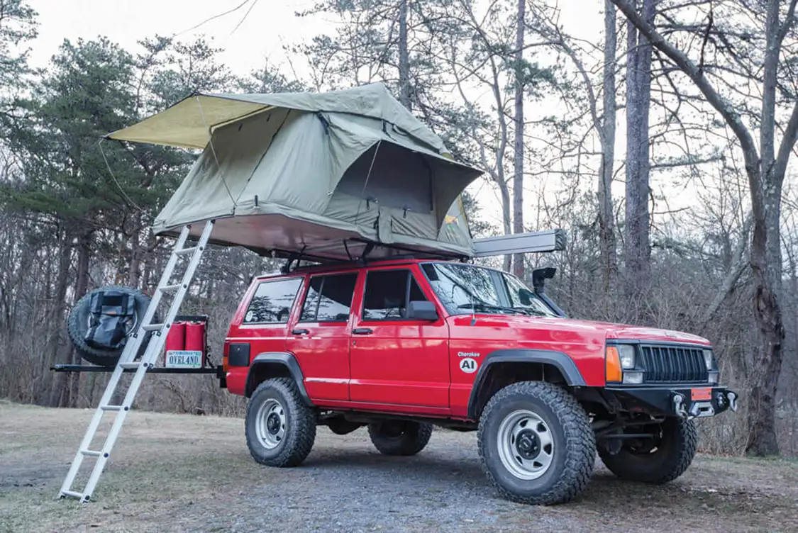 Jeep Cherokee XJ with roof top tent ready for camping