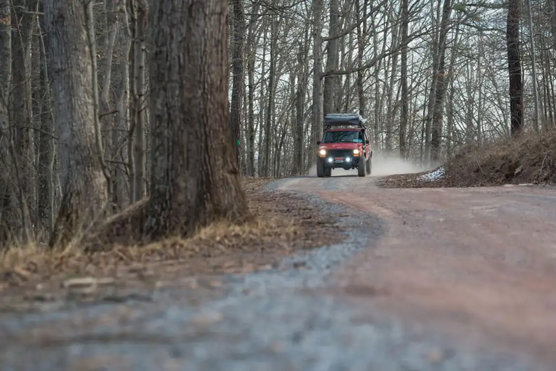 Jeep Cherokee XJ driving in the woods