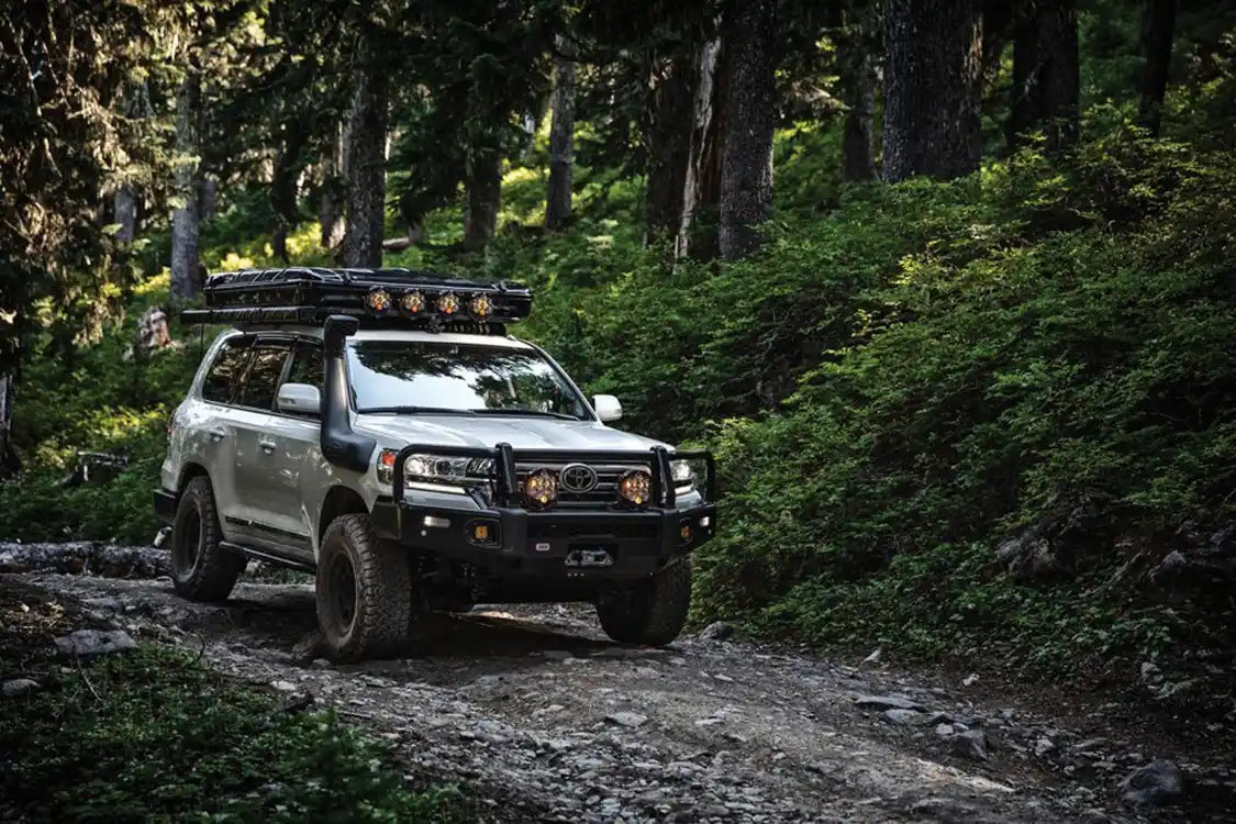 Toyota Land Cruiser 200 Series driving on gravel road