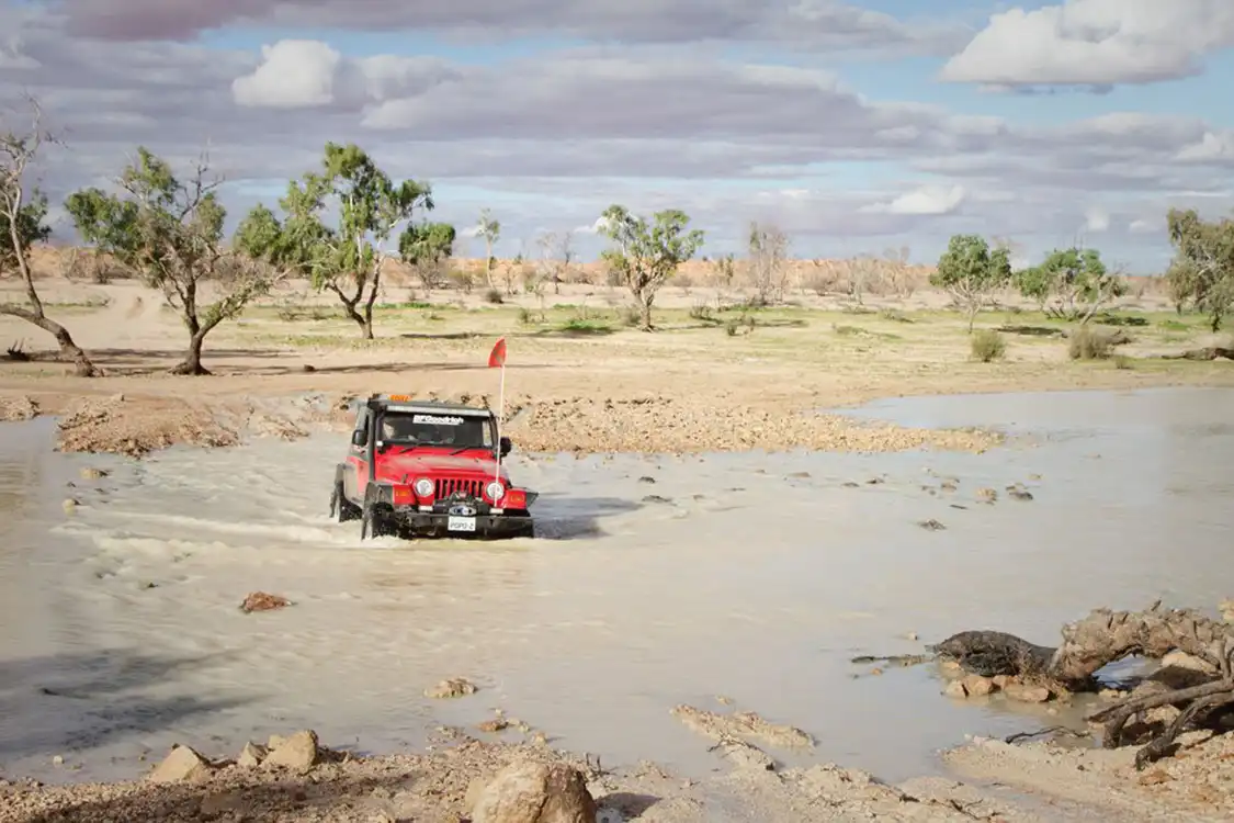 Jeep traveling through muddy water Australia