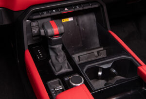 Gear shifter and red interior of red interior of 2022 Toyota Tundra TRD Pro in Super White