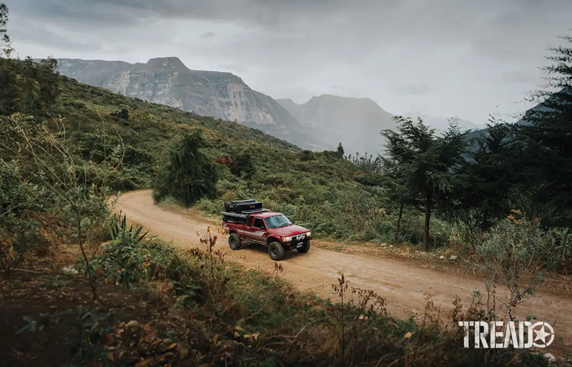 A dirt road track leads to Gocta Waterfall