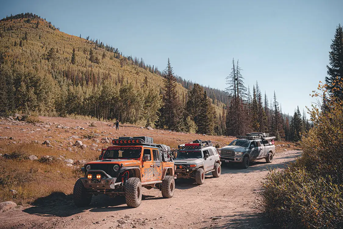 The rigs on the Colorado trip take a break on the trail