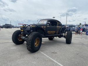 Custom black buggy with Rockstar garage on driver door.